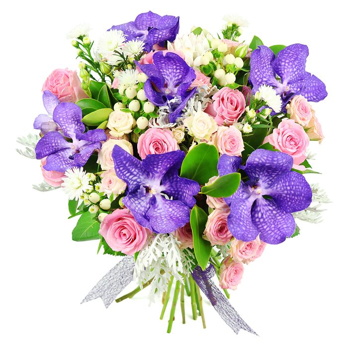 This sophisticated hand-tied bouquet is set against a clean white background, allowing its rich jewel tones and soft pastels to take centre stage. Several show-stopping Vanda orchids, in sumptuous shades of purple and indigo, anchor the design. Their broad petals are marked with intricate mottling and fine veins, giving each bloom an almost architectural presence, like stained glass glimpsed through one of Clerkenwell's historic church windows. Surrounding these exotic flowers are layers of pastel pink roses, some tightly curled like secrets yet to be shared, others fully open with generous, swirling petals that convey softness and romance. Smaller creamy white spray roses add fullness and depth, slipping into the gaps between the larger blooms to create a plush, cushion-like effect. Dotted throughout are tiny white filler flowers and rounded white hypericum berries, which bring a bright, pearl-like clarity to the arrangement. Silvery, feathery dusty miller foliage threads through the bouquet, its cool grey tones playing gently against the more saturated purples and pinks, while glossy dark green leaves provide a lush, grounding frame. The stems are expertly gathered and secured with a sheer, iridescent ribbon in silver and violet, catching the light in a way that subtly echoes the orchids' sheen. Created with the care and precision you'd expect from an experienced Clerkenwell florist, this bouquet feels at once modern and timeless. It would be at home gracing a contemporary loft near St John's Square, marking an anniversary dinner at a local restaurant, or arriving as same-day flower delivery to an office by Farringdon Station, carrying with it sentiments of admiration, gratitude, and heartfelt celebration.