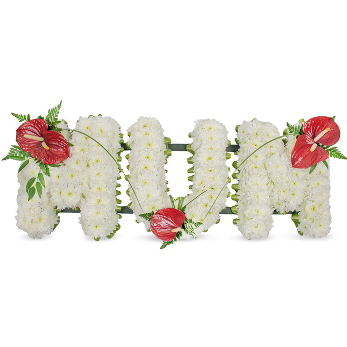 A poignant floral tribute spells 'MUM' in clear, upright capitals, each letter densely covered with hundreds of small, immaculate white chrysanthemums that create a plush, even surface. The tightly packed blooms offer a gentle, pillowy texture, their layered petals catching a cool daylight that makes the white glow quietly rather than shout. A discreet dark-green framework holds the letters' form; it remains largely hidden beneath the flowers but appears as a soft outline along the edges, assuring the freestanding shapes retain their graceful silhouette. Three striking red anthuriums-glossy, sculptural and heart-like, each with a pale yellow spadix-are placed with careful balance: one on the upper left of the first M, one tucked into the lower curve of the U, and one crowning the upper right of the last M. Surrounding the anthuriums are sprays of lush foliage, from feathery fern fronds to broader, waxy leaves, which add a woodland freshness and punctuate the white with rich green tones. Slender, arching green stems or grass blades connect the red accents, drawing the eye across the letters and providing a subtle sense of flow. Intended as a sympathetic, reverent design for a mother's memorial, this classic composition carries the restraint and warmth suited to services in Clerkenwell and nearby Finsbury-an arrangement that balances dignity, love, and quiet remembrance.