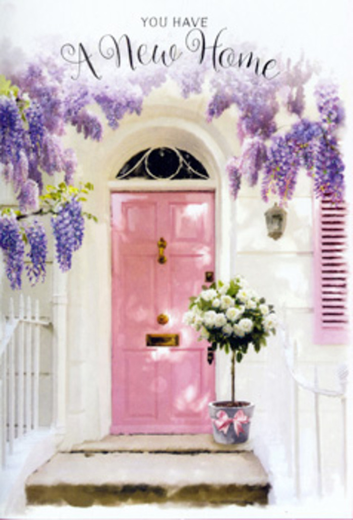 A lovingly styled doorway scene in the heart of Clerkenwell captures the magic of turning a new address into a true home. The focal point is a delicately painted pink door, the kind of soft, dusky blush you might glimpse on side streets off St John's Square, glowing subtly as it reflects the ambient daylight. Above and around it, wisteria pours in velvety drapes of lavender and lilac, each cluster of tiny blossoms forming a lush, fragrant curtain that frames the entrance like nature's own garland. The walls are gently whitewashed, their slightly textured surface catching the light in quiet, irregular patches, while a matching pastel shutter rests against the wall, echoing the gentle colour palette and hinting at a calm, airy interior. Anchoring the scene at ground level, a stylish tin bucket in cool grey sits neatly on the doorstep. From it rises a generous, hand-arranged bouquet of creamy white roses and soft greenery, the roses at their fullest, petals spiralling open in a way that speaks of expert conditioning and care. A blush satin ribbon wraps the bucket with a relaxed bow, its trailing tails softening the hard edge of the metal. The whole composition feels like it might belong to a freshly moved-in couple celebrating their first evening in a flat just off Clerkenwell Road, welcoming friends with flowers and warm light. There is a gentle hum of anticipation and comfort: wisteria scent mingling with the imagined aroma of dinner, and roses marking the threshold as a place of friendship, shared stories, and cherished London memories in the making.