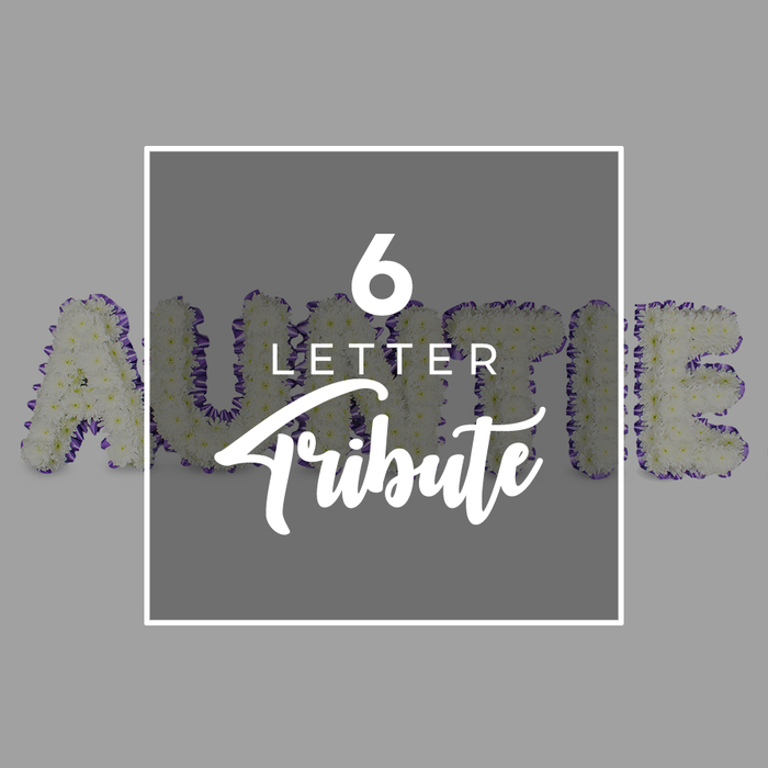 An artisan carryover of craft and care is evident in this tribute where six freestanding letters spell AUNTIE and rise in confident, generous shapes. The letters are densely filled with white chrysanthemums, their petals overlapping to create a plush, cloud-like surface that conveys purity and remembrance. Each edge is crisply defined by a purple trim of small blossoms or a ribbon, bringing a note of colour and personality to the monochrome field. The backdrop remains a soft neutral gray, letting the white blooms breathe as if lit by a gentle morning light. In the center, a square white frame overlays the arrangement, with the bold 6 LETTER mark and the word Tribute written in script, a clear sign of a personalised memorial. This piece embodies thoughtful craftsmanship, a bespoke statement for a loved aunt, and it reads well in church halls or chapels near Clerkenwell's markets and lanes, including Exmouth Market and the City fringes. Delivery is available across Clerkenwell, EC1, ensuring this heartfelt tribute can grace wakes and ceremonies in nearby Holborn, Farringdon, or Barbican venues.
