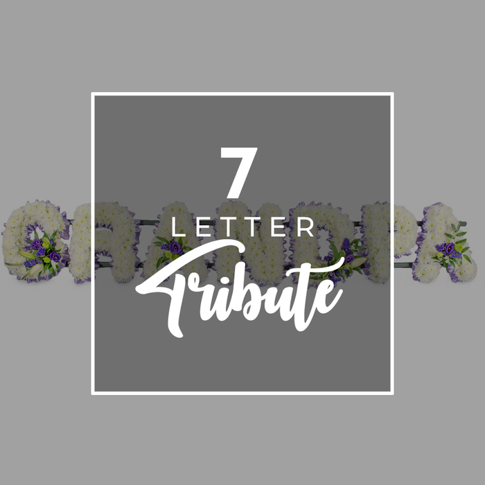 This image presents a thoughtful blend of typography and funeral floristry, ideal for families in Clerkenwell searching for personalised memorial flowers. The background is a soft, even grey that allows the central feature-a slightly darker grey square with a slim white border-to stand out cleanly. Inside this square, white text reads 7 LETTER Tribute, with the single digit 7 largest at the top, LETTER in smaller capital letters below, and Tribute written in an elegant, flowing script that conjures the feel of a handwritten card placed beside the casket. Behind this graphic, partially obscured but still recognisable, is a seven-letter floral word tribute spelling GRANDMA. Each letter is formed as a freestanding frame densely covered in small white chrysanthemums, giving every surface a plush, full finish. The flowers are tightly layered so the letters look substantial and well-defined, from the open bowl of the G through to the strong lines of the final A. Threaded through the white base are touches of vibrant purple flowers, likely lisianthus or petite roses, providing gentle contrast and a sense of depth, much like the interplay of old stone and modern glass along nearby St John Street. Sprays of fresh green foliage break up the white, curling softly around the accent blooms and evoking a freshly gathered feel. The lighting appears even and neutral, keeping the focus on the clean shapes and colours. Overall, the image communicates a calm, respectful tone and highlights the idea of a custom seven-letter funeral flower tribute for a cherished grandmother, suitable for display beside the coffin or hearse and available for careful, same-day delivery within Clerkenwell and the surrounding EC1 area.