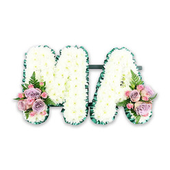 Against a clean white background, a handcrafted floral letter tribute spells out the word MA in serene, snowy white blooms, evoking the quiet, reflective corners of Clerkenwell's historic lanes. The two capital letters stand side by side, joined subtly at the base so they appear as one continuous, flowing piece. Every part of the M and A is covered in tight clusters of white chrysanthemums, their petals layered like tiny feathers, creating a richly textured surface that looks soft yet substantial, almost like freshly fallen snow resting on stone. Encircling each letter is a neatly applied band of deep green satin ribbon. This ribbon is gently ruffled, forming a delicate pleated edge that gives the design structure and polish while echoing the green of nearby parks and trees. At the lower left of the M and the lower right of the A, two mirrored sprays bring in colour and emotion. Pale pink roses mingle with lilac-toned blooms, their velvety petals opening in gentle spirals, while smaller pink spray roses nestle between them for added depth. Wisps of fern and sprigs of greenery extend beyond the roses, light and airy, adding a natural softness that stops the white letters from feeling too stark. The tribute suggests a heartfelt message for a mother or cherished Ma, perhaps chosen by a family gathering after a funeral service near Exmouth Market or Farringdon. Its combination of pure white sympathy flowers and tender pink and purple accents conveys both sorrow and gratitude, a quiet statement of respect and remembrance crafted by expert Clerkenwell florists who understand how flowers can speak when words are not enough.
