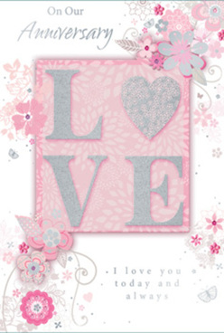 This anniversary card is captured in close detail, revealing a design that feels as serene and romantic as an early morning walk through Spa Fields in Clerkenwell. The focal point is the word "LOVE," rendered in large, raised letters that have been gently brushed with glitter, giving a frosted, sparkling texture that invites touch as much as sight. The letters sit on a blush-pink panel, subtly lighter than the surrounding background, as if a soft spotlight were cast across the centre of the card. Around this central word, fine, stylised flowers and curling foliage spread outward in airy arcs, their stems and leaves drawn with the delicacy of a florist's sketch when mapping out an anniversary bouquet. Each bloom is formed from slender petals in shades of blush pink, pearly white, and light grey, with silver touches that glimmer along the contours like tiny veins in fresh petals. The backdrop is a smooth, powder-pink field, calming and even, which allows the textured letters and intricate floral details to stand out. Tiny scrolls, tendrils, and leaf shapes weave between the flowers, echoing the graceful lines of a well-arranged cascade of flowers in a Clerkenwell Flowers anniversary design. The message, written in a stylish, flowing script, rests harmoniously within the composition, its curves following the gentle movement of the vines. Together, these elements create a sense of thoughtful celebration and long-standing affection, the card itself feeling like a paper bouquet-carefully composed, beautifully balanced, and perfect for marking another year shared together in this characterful corner of London.