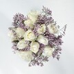There's a distinct sense of calm that emanates from this Clerkenwell-inspired bouquet-a harmonious gathering of full, creamy white roses encircled by the light, lacy touch of lavender statice. Each rose opens gracefully, revealing a soft heart and gentle layers, the texture reminiscent of silk or the quiet hush of early mornings near Clerkenwell Green. The statice, with its fine, branching stems and papery blossoms, provides an ethereal backdrop, almost as though a lavender mist had settled among the roses, adding delicate contrast and natural elegance. Bathed in diffused daylight, the arrangement's palette feels pure and freshly hopeful, perfect for expressing grace during weddings, anniversaries, or heartfelt celebrations within the EC1 community. The emotional tone is quietly romantic, suggesting a pause in the city's busy pace-a moment to appreciate beauty and sincerity. The bouquet's scent is gentle and uplifting-a blend of soft floral notes with subtle herbal hints, evoking the refreshing air of Clerkenwell's garden squares. Crafted by an experienced local florist, this arrangement is thoughtfully composed to be both comforting and joyful, designed to bring a touch of lasting affection and serene radiance to any Clerkenwell doorstep.