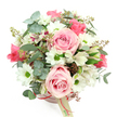 Soft, romantic blush hatbox bouquet shown from a slightly elevated viewpoint on a pure white surface, the kind of refined floral piece you might send to a friend living near Clerkenwell Green. The round flower box is a muted blush pink with a smooth finish, cinched neatly by a slender reddish-pink satin ribbon, from which a small cream tag hangs, suggesting a personalised note from a caring local florist. Rising from this base, the flowers are arranged into a generous, domed shape, overflowing just enough to feel abundant yet still composed. Light pink roses dominate the design; their petals are thick and velvety, coiling in soft spirals, some roses fully open like calm, romantic declarations, others only half in bloom. Between them, snow-white daisy-like chrysanthemums punctuate the pink with their crisp petals and bright green centres, giving the arrangement a fresh, joyful lift much like a bright morning walking toward Farringdon station. White alstroemeria are scattered throughout, each bloom etched with fine purplish-red freckles and streaks that add a refined, almost painterly texture. Surrounding and weaving among the flowers, rounded silvery-green eucalyptus leaves form a cool backdrop, while darker green, strap-like foliage provides depth and gentle structure. Here and there, tiny clusters of reddish-brown buds or berry-like elements introduce a subtle, earthy warmth. The overall mood is one of gentle celebration and affectionate thoughtfulness, ideal for birthdays, Mother's Day or simply to brighten someone's week with a same-day delivery to a Clerkenwell flat, studio or office where a touch of floral softness is needed.