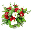 A beautifully balanced bouquet of red roses and white calla lilies fills the frame, photographed against a pure white background that heightens the drama of its colours and textures. Seen from a gently elevated perspective, the arrangement forms a rounded, abundant dome, as if placed at the centre of a polished table in a Clerkenwell loft or a stylish office near Farringdon Station. At its heart, clusters of deep crimson roses draw immediate attention, their velvety petals tightly layered to create full, classic blooms that embody romance, passion, and commitment. Among them, slender white calla lilies rise with graceful curves, their smooth, trumpet-shaped spathes unfurling around pale yellow spadices, bringing a sense of minimalist elegance that would suit both modern weddings and sophisticated anniversaries. Surrounding this interplay of red and white, lush greenery provides volume and visual rest: soft eucalyptus stems, dotted with small, rounded, silvery-green leaves, weave through the arrangement, while stronger, darker green foliage anchors the design, suggesting the freshness of local parks and garden squares on a clear Clerkenwell morning. The bouquet is gathered into a clear glass vase, of which only the subtly ribbed base is visible beneath the overflowing stems, reinforcing that the flowers themselves are the true focus. Gentle, diffused lighting ensures no harsh shadows interrupt the view, allowing the roses, lilies, and leaves to stand out with crisp detail. This arrangement feels ideal for romantic gifts, wedding centrepieces, or heartfelt celebrations delivered to homes, studios, and creative spaces across Clerkenwell, where timeless floral beauty is given a contemporary, urban edge.