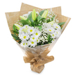 Set against a clean white background, this hand-tied bouquet of white and green blooms looks calm, composed, and freshly prepared for delivery somewhere in Clerkenwell. The main focus is a generous cluster of white daisy-like chrysanthemums, each flower rounded and full, with crisp petals fanning delicately around a soft yellow-green centre that brings a touch of warmth to the cool palette. These blossoms sit tightly together, creating a plush, comforting surface that feels both gentle and reassuring. Standing among them are several slender lily buds, still closed and sculptural, their smooth, pale green exteriors tipped with creamy white, quietly suggesting the fragrance and beauty that will emerge over the next few days. Threaded through the larger blooms, fine sprigs of baby's breath form small clouds of tiny white flowers, adding an ethereal, floating quality to the arrangement. Rich, glossy green leaves wrap around the outside, framing the bouquet with natural depth and contrast, like a patch of greenery glimpsed between brick buildings near St John Street or along Clerkenwell Green. The florist has gathered the stems and wrapped them first in rustic brown kraft paper, its softly crinkled surface lending a tactile, handmade feel, before adding a clear layer of protective cellophane that reflects the light in subtle highlights. The base is neatly tied, forming a tidy cone that looks easy to hold when carried to a quiet visit, a condolence call, or a hospital room. Overall, the bouquet conveys a mood of purity, peace, and gentle remembrance, ideal for expressing sympathy or sending a calm, hopeful message in times of loss.