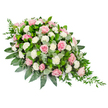 A refined funeral flower spray is shown against a spotless white background, its distinctive shape forming an elongated teardrop that appears ready to rest on a casket or be placed as a main tribute at a memorial service. The top left of the arrangement is rounded and full, gradually slimming into a delicate, pointed tail on the bottom right, giving the entire piece a sense of gentle motion and release. The spray is densely composed of soft pink roses, each bloom layered with velvety petals in tones from pale blush to warm rose, scattered evenly so the eye travels smoothly along the length of the design. Interwoven among the roses are clusters of white carnations, their finely frilled petals creating a soft, cushion-like effect and a contrast that brightens the pinks without overpowering them. A substantial base of lush foliage supports the flowers: broad, glossy dark green leaves hold the structure securely, while rounded eucalyptus leaves in muted, silvery green add depth and a subtle, cooling note, reminiscent of the calm greenery found in nearby Clerkenwell gardens and quiet churchyards. Slim strands of darker green trailing foliage spill from the tapered end and the sides, emphasising the spray's flowing silhouette. The arrangement feels carefully considered, as though shaped by a florist used to guiding families through difficult moments, offering a visual expression of condolence for funerals held in and around Clerkenwell. Overall, it conveys serenity, respect, and a gentle, enduring affection for the person being honoured.