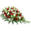 This image shows a graceful sympathy spray of red roses and white carnations, photographed sharply against a clear white background so that the full shape and colour palette can be appreciated. The arrangement lies horizontally, with the left side appearing broader and more mounded before gently narrowing and sweeping down to a slender, tapering point on the right. Lush, deep red roses are positioned throughout, their petals tightly furled and velvety, creating rich pockets of colour that suggest deep affection and solemn respect. Nestled among them are many white carnations, their layered, ruffled petals giving a soft, almost feathered texture that brightens the spray and brings a sense of peaceful purity. Supporting the blooms is an abundant base of greenery. Dark, broad leaves provide structure and a glossy, grounding backdrop, while paler, silvery eucalyptus leaves weave between the flowers, adding a muted, misty tone and hinting at a gentle, fresh fragrance. From the right-hand tip, slender, trailing green stems and foliage arc outward, giving the piece quiet movement and a natural, cascading finish. The composition is both formal and tender, the red-and-white contrast reflecting themes of love, honour, and serene remembrance. It would be perfectly at home as a casket spray or major memorial tribute at a funeral service in Clerkenwell, perhaps in one of the area's traditional churches or modern chapels, offering families a meaningful floral expression of sympathy and farewell.