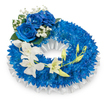 A serene, circular memorial wreath composed with quiet dignity, shown against a clean white background so every colour and texture reads clearly. The body of the ring is densely packed with countless deep blue chrysanthemums, their small, finely divided petals creating a plush, almost velour surface that catches soft studio light and suggests depth and consolation. A ruffled, pleated band of white satin ribbon traces the inner circumference, its subtle sheen and gentle folds framing the blue like a calm margin. At the upper-left curve three large blue roses form a deliberate focal cluster; their velvety, sapphire-hued petals open fully, rich and tactile against the compact chrysanthemum field. Tiny sprays of white gypsophila and a few dark green leaves are nestled around the roses, lending a breath of air and classic sympathy detail. From mid-left the composition releases into a graceful cascade of pristine white orchids, their Phalaenopsis-like blooms arching toward the lower right in an elegant, flowing line. Among the open orchids sit several pale green buds, some tight and some beginning to unfurl, a quiet symbol of continuity amid remembrance. The overall impression is hushed and respectful: cool blues that speak of peace and memory, luminous whites for purity and solace, and textures that range from spiky chrysanthemum to silky orchid and glossy ribbon. As a florist who prepares tributes for families across Clerkenwell - from Exmouth Market to St John's Square - I imagine this wreath placed beside a memorial card, its subtle scent of roses and orchids offering a gentle comfort to those gathered.