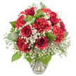 A classic red and white bouquet stands in a simple clear glass vase, photographed against a bright white background that draws all attention to the flowers themselves. Several deep red roses rise confidently from the centre, their velvety petals still partially furled into tight spirals, suggesting a love story that is unfolding rather than complete. Around them, rich red carnations expand outward in layers of soft, ruffled petals, building a sense of fullness and abundance that feels both generous and comforting. Between these bold crimson blooms, clusters of white baby's breath appear like tiny clouds, their small, star-shaped flowers adding lightness, delicacy, and a quiet sense of purity that balances the intensity of the red. Fresh greenery is woven thoughtfully throughout the arrangement: dark, glossy foliage from the rose stems combine with softer, rounded eucalyptus leaves, whose muted, silvery-green tones introduce a calm, modern note, much like stepping off busy Clerkenwell Road into a peaceful courtyard. The bouquet is shaped into a rounded dome, with no visible gaps, as though a local florist has turned the flowers carefully in their hands to ensure every angle is equally beautiful. The vase, subtly fluted and sturdy at the base, holds clear water in which the neatly trimmed stems are clearly visible, underscoring both freshness and professional care. Bright, even lighting emphasizes the vivid reds and crisp whites, making this arrangement ideal to imagine on a windowsill in Clerkenwell, a romantic centrepiece for a dinner near Farringdon, or a thoughtful delivery to mark anniversaries, celebrations, or heartfelt thank-yous.