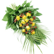 A striking, elongated funeral arrangement of yellow roses and red berries rests against a bright white backdrop, the simplicity of the background emphasising the colour and form of the flowers. The spray is designed in a classic teardrop shape, broader at the upper left where the stems are bound together, and gradually tapering towards the lower right. At its core, a profusion of yellow roses forms the main body of the piece. Some roses remain in neat, rounded buds, while others are fully open and generous, revealing layered petals with a rich, golden glow that evokes warmth, gratitude, and gentle remembrance. Scattered throughout are clusters of red Hypericum berries, small and perfectly rounded, their smooth surfaces reflecting light and providing a calm but vivid contrast to the roses. The arrangement is held together by a lush framework of greenery. Near the bound stems at the top left, sturdy, dark green leaves are arranged in overlapping layers, some skillfully folded back to add structure and depth. As the spray extends downwards, long, arching palm-like fronds fan out from the lower right, their slender leaflets tapering to fine tips that lend the design a sense of movement, as though it were subtly flowing across the surface. The piece feels both contemporary and timeless, suitable for placing on a coffin, beside a lectern, or near a memorial display in Clerkenwell's churches and crematoria. Its combination of warm yellow tones, rich red berries, and deep green foliage offers a composed, heartfelt tribute for saying goodbye to a loved one with dignity and care.