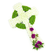 This image shows a beautifully composed Celtic cross floral tribute, photographed in a bright, white studio setting that emphasises every detail of the design. The entire cross is constructed from fresh chrysanthemums, with the main arms and central shaft formed from tightly packed white blooms. Their small, layered petals create a soft, pillowed surface, giving the shape a gentle, cushioned appearance. Tracing the outline of the cross and its characteristic circular ring, compact lime green button chrysanthemums provide a vivid contrast, their rounded heads forming a neat, continuous border that highlights the Celtic pattern. The combination of white and green feels clean and contemporary, yet still rooted in tradition, much like many of the sympathy tributes chosen by families around Clerkenwell Road and Rosebery Avenue. On the lower section of the vertical arm, three carefully placed groupings of deep magenta-purple carnations introduce a richer tone. These ruffled blooms sit slightly raised above the white base, their velvety petals suggesting love, respect, and remembrance. Fine strands of dark green foliage and slim, woody tendrils weave gently through and around the carnations, adding movement and a sense of natural grace, as though the cross is being lightly embraced by trailing garden greenery. The lighting is even and soft, with no harsh shadows, allowing the intricate textures of each flower head to be clearly seen and felt in the mind's eye. The overall impression is one of quiet dignity and serenity, a thoughtful funeral or memorial tribute that would feel especially fitting for a service or celebration of life within the Clerkenwell area, where families value both craftsmanship and heartfelt symbolism.